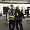 Purple belt father Jeremy Mares and son Adrian training BJJ together as a family activity at Primate Jiu Jitsu in Tulsa OK